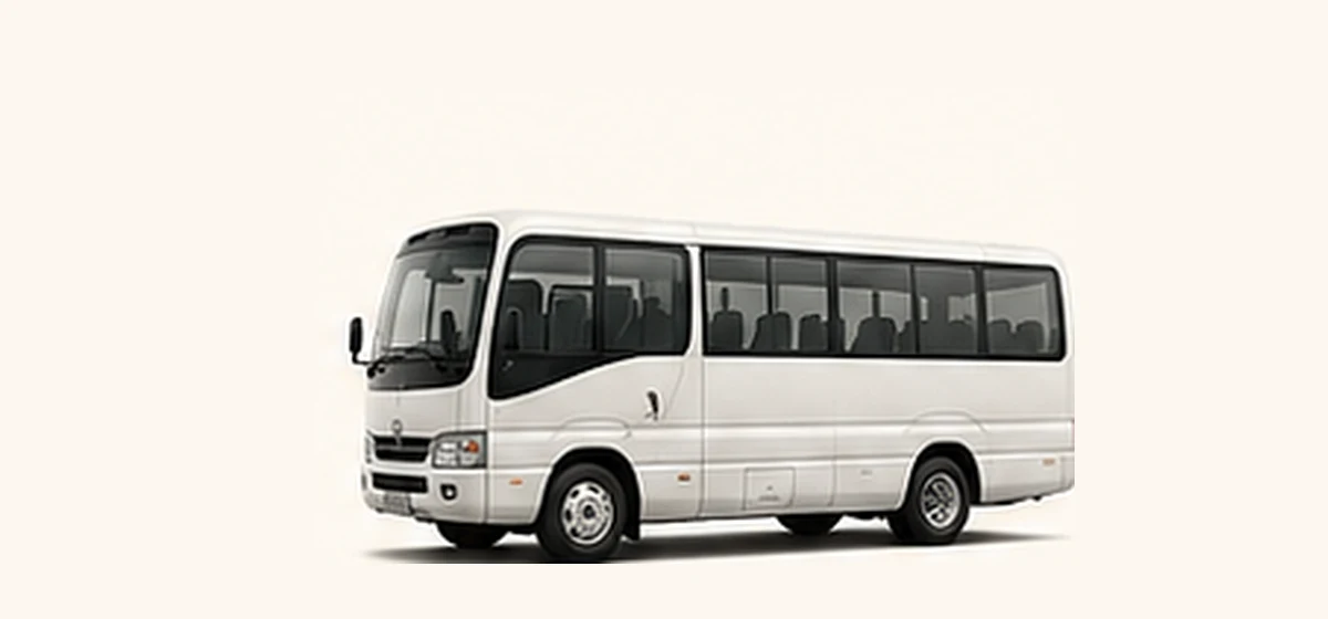 White minibus or coaster suitable for fifteen to twenty-two passengers