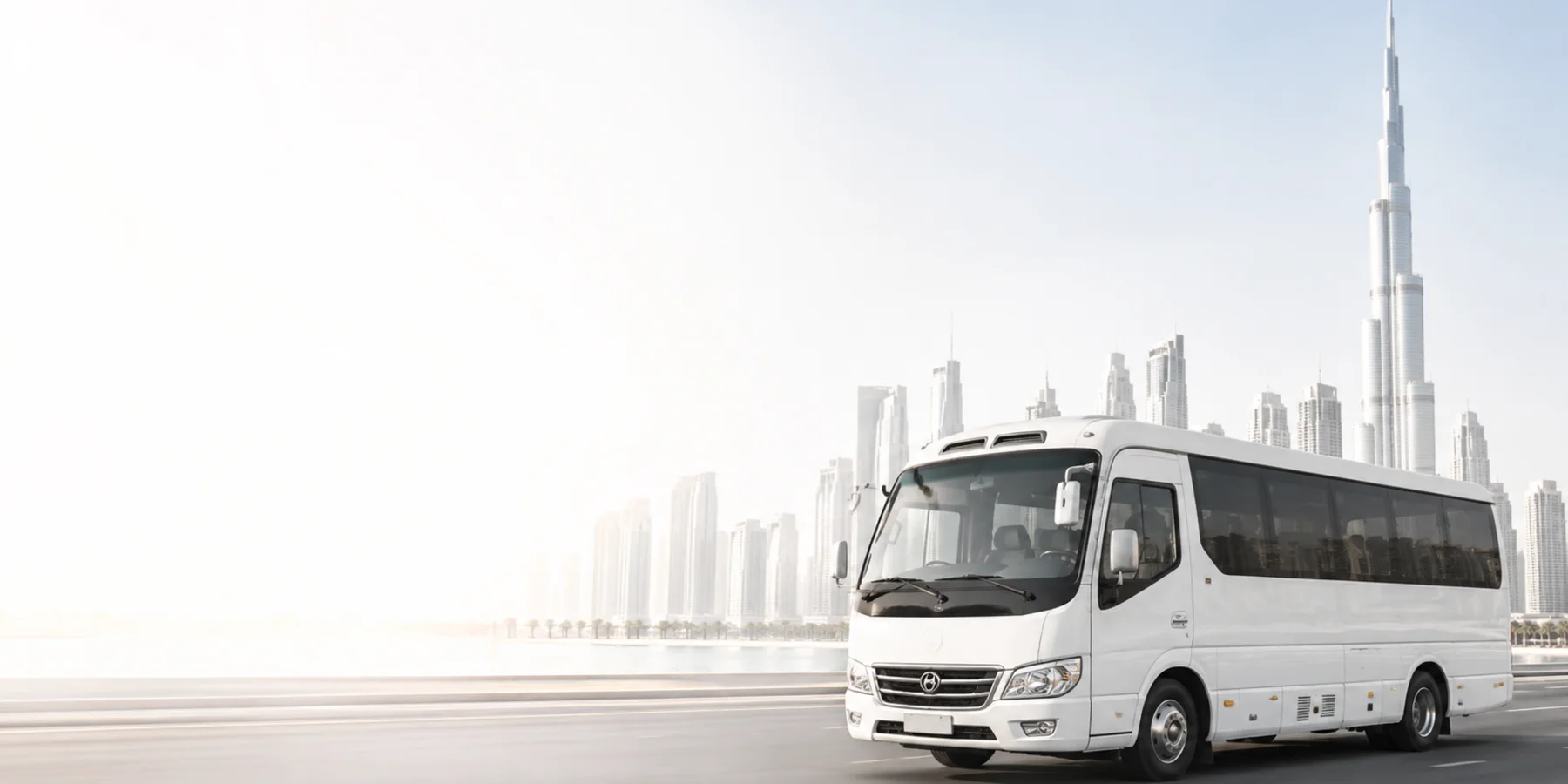 White minibus travelling through Dubai