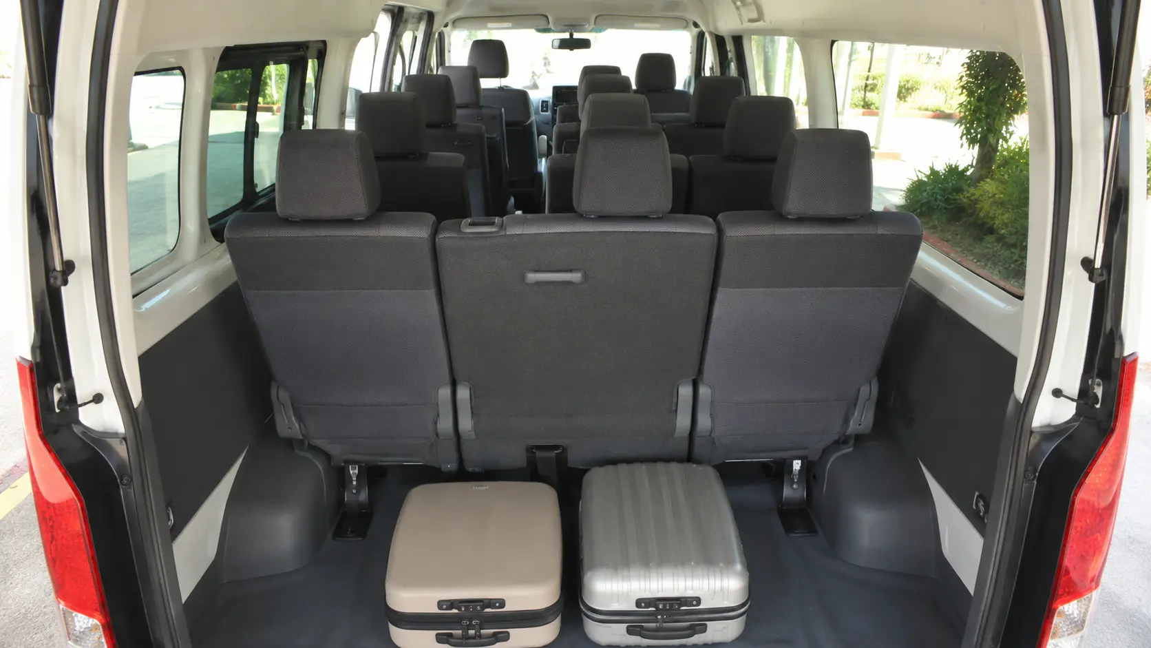 Passenger seating and luggage configuration inside a 12 seater van in Abu Dhabi